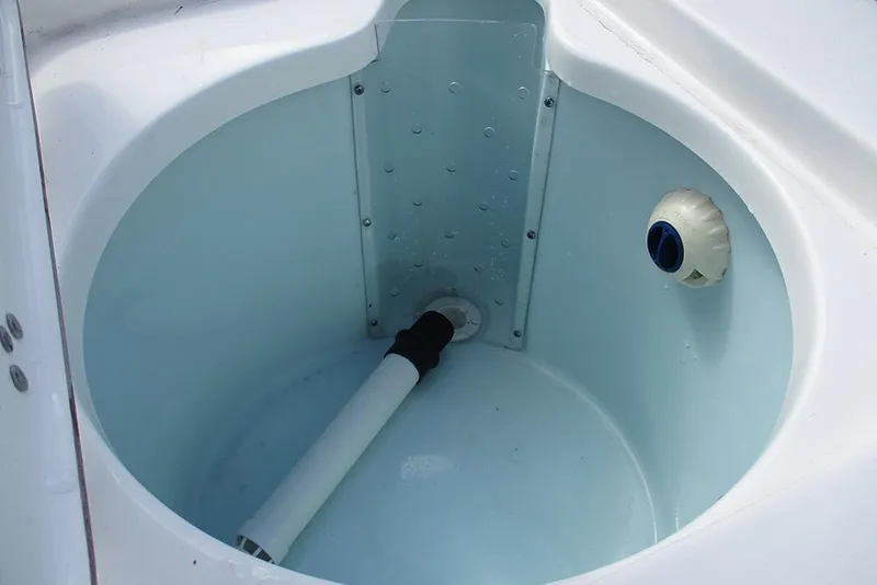 Slide: The Image of Livewell interior of 2026 Sea Pro 210 Bay boat, featuring drainage and aeration system. - 20