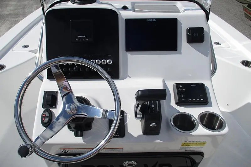 Slide: The Image of 2026 Sea Pro 210 Bay boat console with steering wheel and controls. - 25
