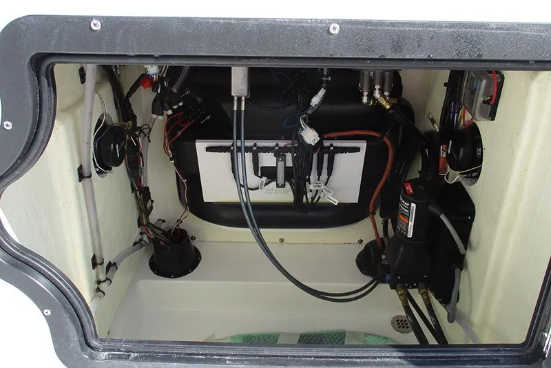 Slide: The Image of Interior view of 2026 Sea Pro 210 Bay boat's wiring and mechanical components. - 28