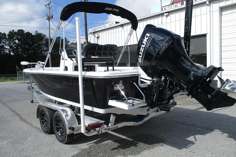 Slide: The Image of 2026 Sea Pro 210 Bay boat with Suzuki outboard motor on a trailer. - 6