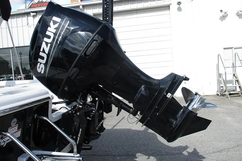 Slide: The Image of 2026 Sea Pro 210 Bay with Suzuki outboard motor, parked outdoors. - 7