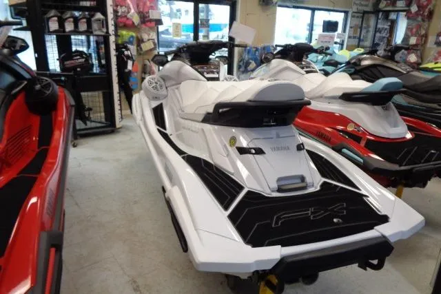 Slide: The Image of 2025 Yamaha WaveRunner FX Cruiser SVHO in showroom, white and sleek design. - 3