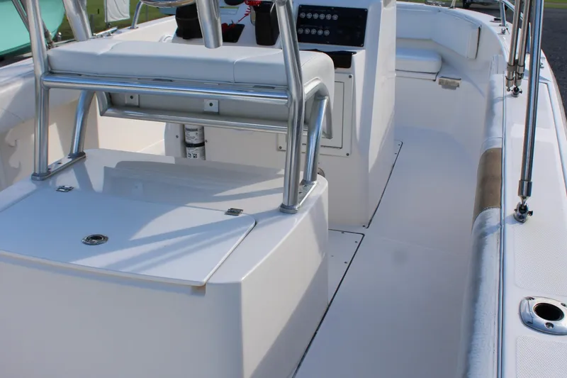 Slide: The Image of Interior view of a 2015 Edgewater 188CC boat, showcasing seating and console area. - 13