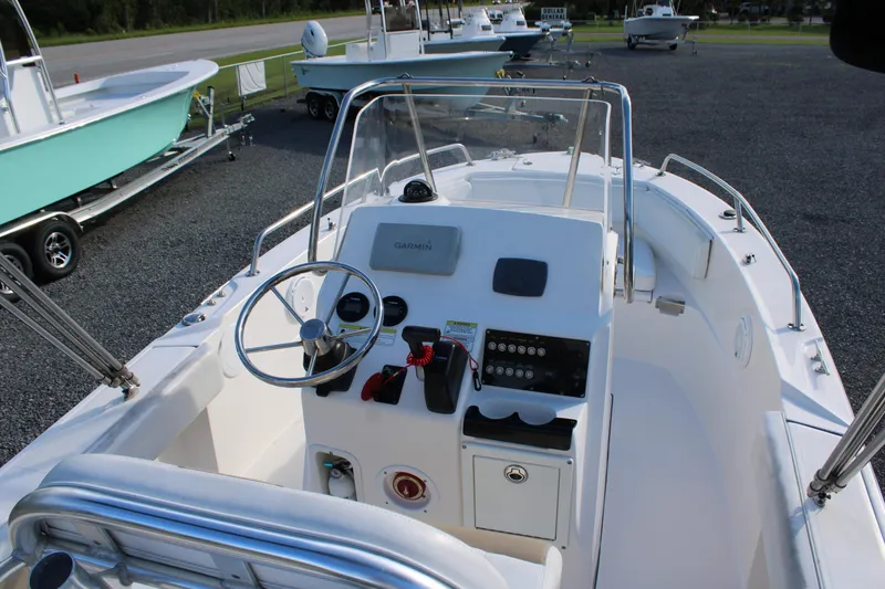 Slide: The Image of 2015 Edgewater 188CC boat interior with steering wheel and control panel. - 15
