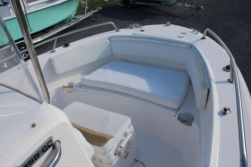 Slide: The Image of 2015 Edgewater 188CC boat interior with white cushioned seating. - 17