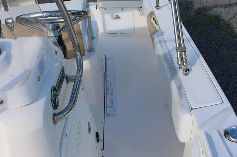 Slide: The Image of 2015 Edgewater 188CC boat interior with steering wheel and seating area. - 18