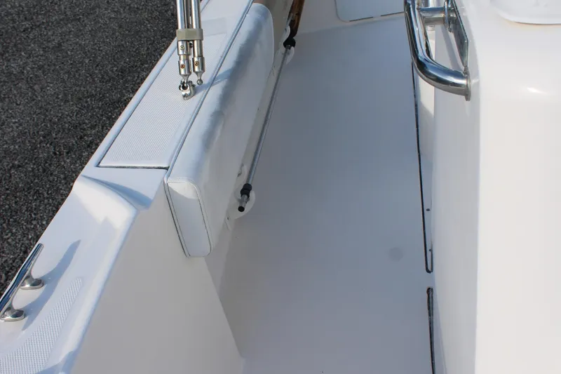 Slide: The Image of 2015 Edgewater 188CC boat interior with white seating and stainless steel railing. - 19