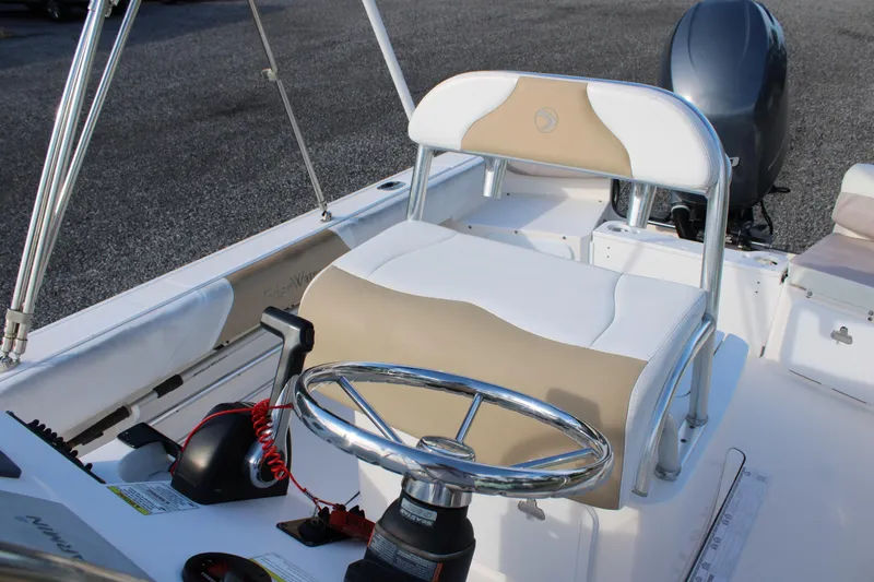 Slide: The Image of 2015 Edgewater 188CC boat interior with steering wheel and seating. - 20
