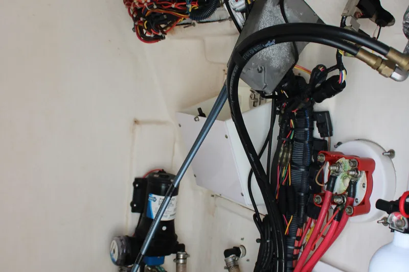 Slide: The Image of 2015 Edgewater 188CC boat wiring and mechanical components in close-up view. - 24