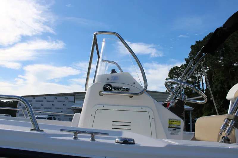 Slide: The Image of 2015 Edgewater 188CC boat console with steering wheel under blue sky. - 4