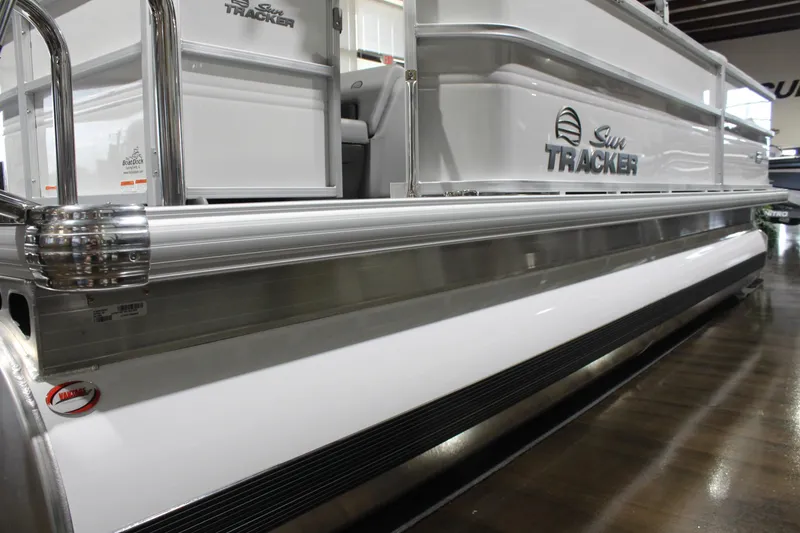 Slide: The Image of 2026 Sun Tracker Party Barge 20 DLX pontoon boat, sleek design, side view. - 3