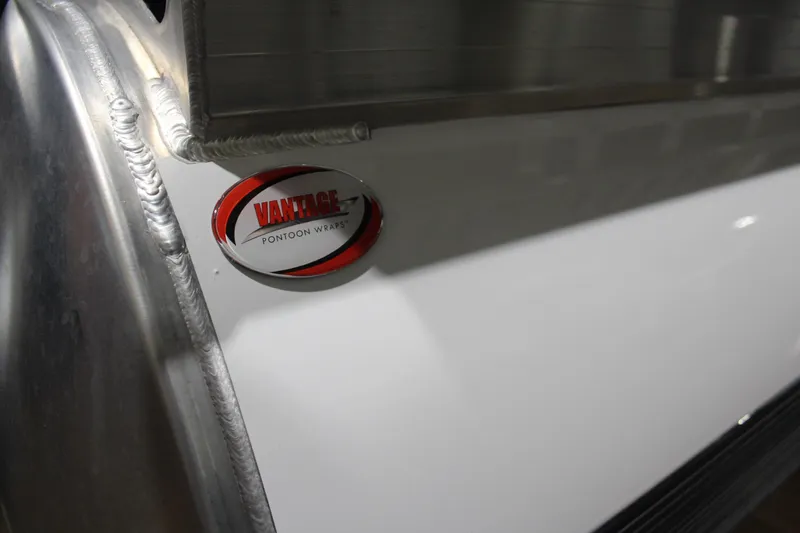 Slide: The Image of Close-up of 2026 Sun Tracker Party Barge 20 DLX with Vantage Pontoon Wraps logo. - 7