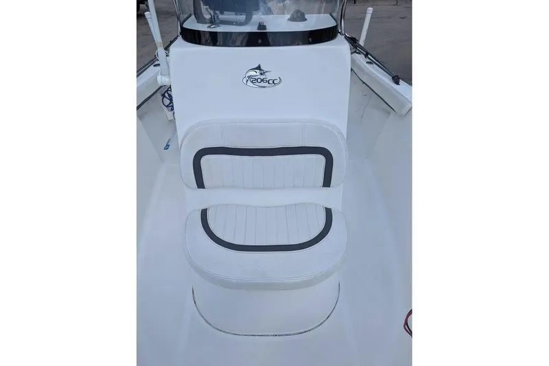 Slide: The Image of 2011 Sea Fox 206 CC PRO Series boat seat with logo, white and black design. - 12