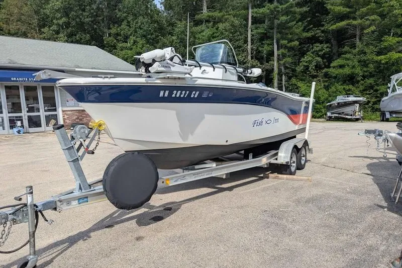 Slide: The Image of 2011 Sea Fox 206 CC PRO Series boat on trailer, parked outdoors. - 5