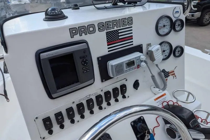 Slide: The Image of Control panel of 2011 Sea Fox 206 CC PRO Series boat with gauges and electronics. - 8