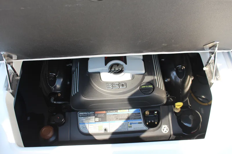 Slide: The Image of 2023 Crownline E285 boat engine compartment with Mercury 350 engine. - 17