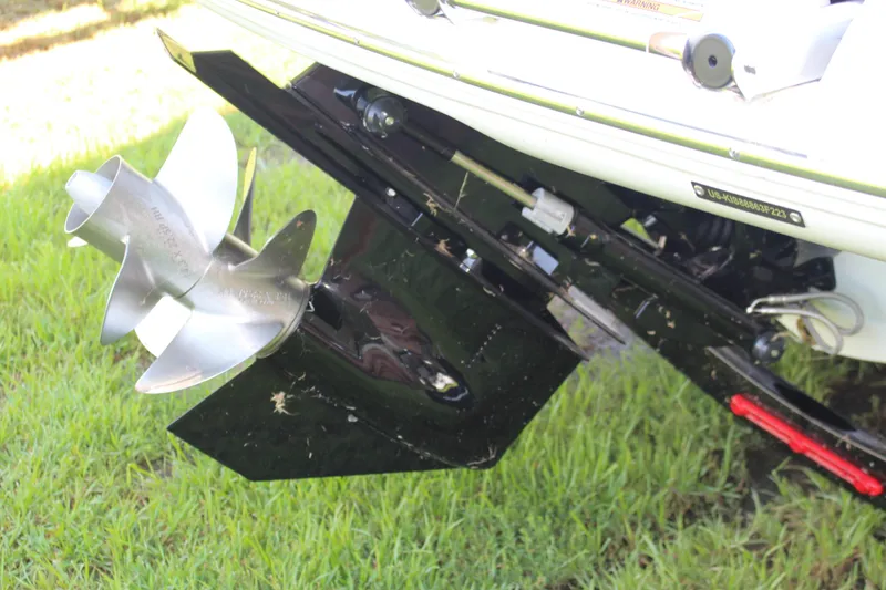 Slide: The Image of 2023 Crownline E285 boat propeller and stern drive on grass. - 34