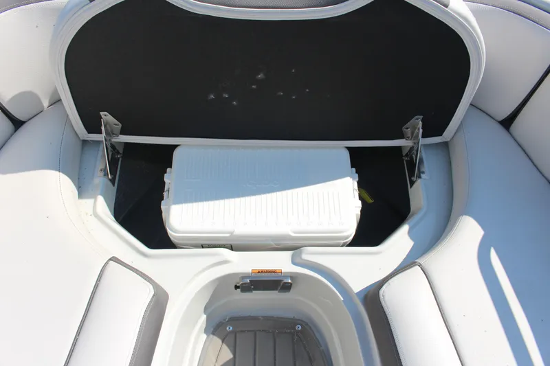 Slide: The Image of 2023 Crownline E285 boat storage compartment with cooler, open seat view. - 54