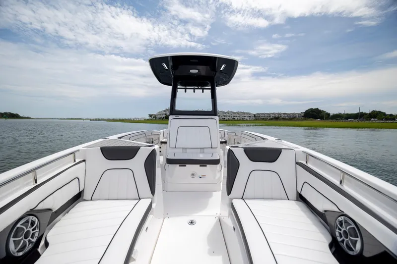 Slide: The Image of 2024 Yamaha Boats 255 FSH Sport H on water, featuring sleek seating and modern design. - 17