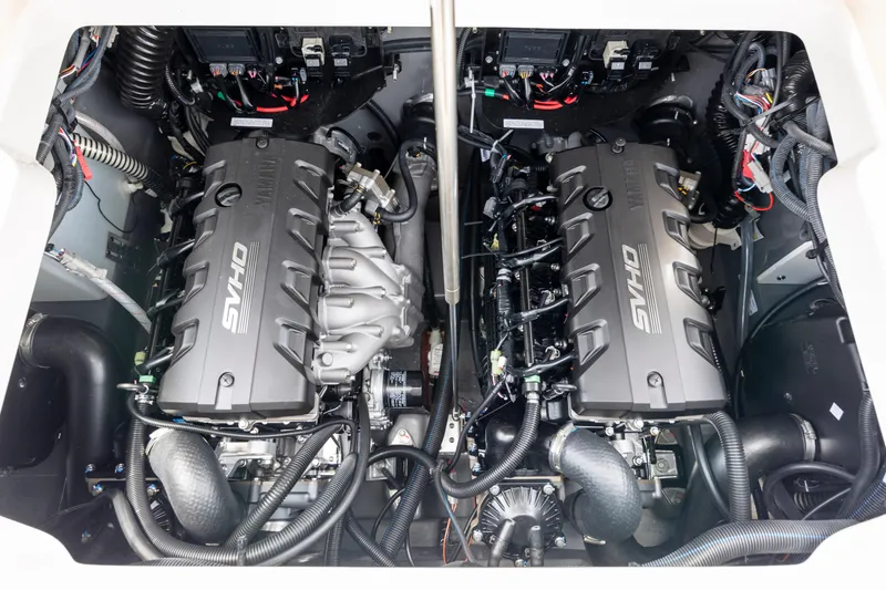 Slide: The Image of 2024 Yamaha Boats 255 FSH Sport H engine compartment with dual SVHO engines. - 22