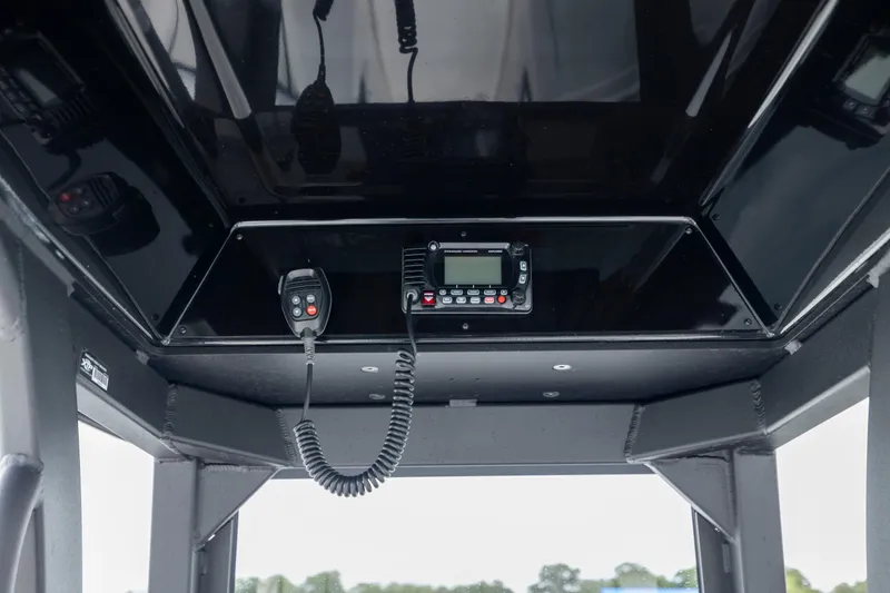 Slide: The Image of 2024 Yamaha Boats 255 FSH Sport H communication system with radio and microphone. - 24