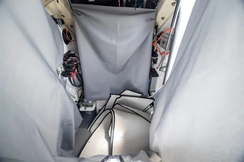 Slide: The Image of Interior view of 2024 Yamaha Boats 255 FSH Sport H, showcasing wiring and components. - 27