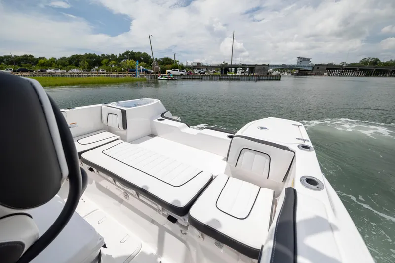 Slide: The Image of 2024 Yamaha Boats 255 FSH Sport H on water, showcasing spacious seating and sleek design. - 8