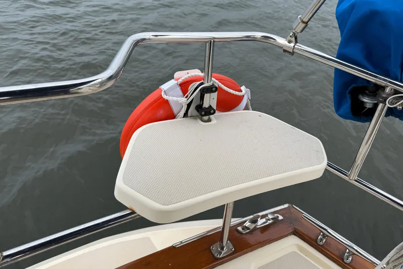 Slide: The Image of 2008 Island Packet 370 boat deck with safety equipment and railing. - 10