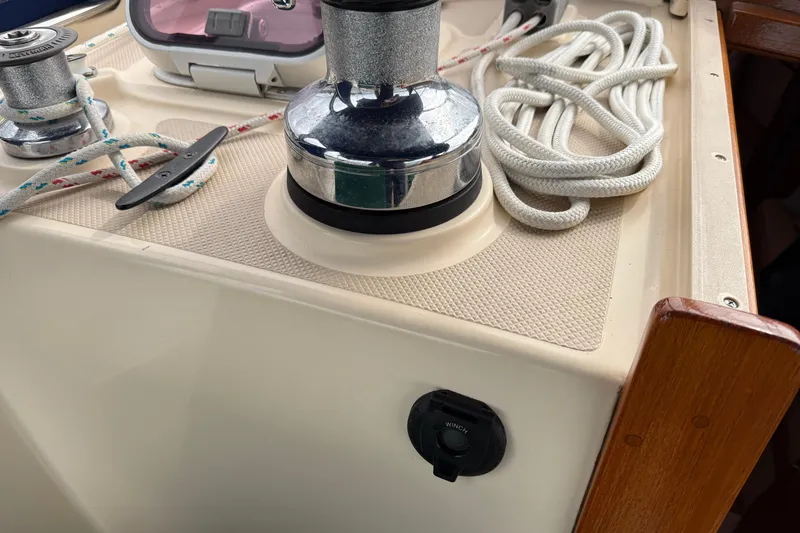 Slide: The Image of 2008 Island Packet 370 sailboat deck with winch, cleat, and coiled rope. - 14