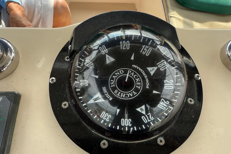 Slide: The Image of Compass on 2008 Island Packet 370 yacht dashboard, displaying cardinal directions. - 17
