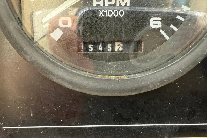 Slide: The Image of Close-up of RPM gauge showing 15452 hours on 2008 Island Packet 370. - 20
