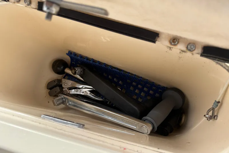 Slide: The Image of Storage compartment with tools on a 2008 Island Packet 370 sailboat. - 22