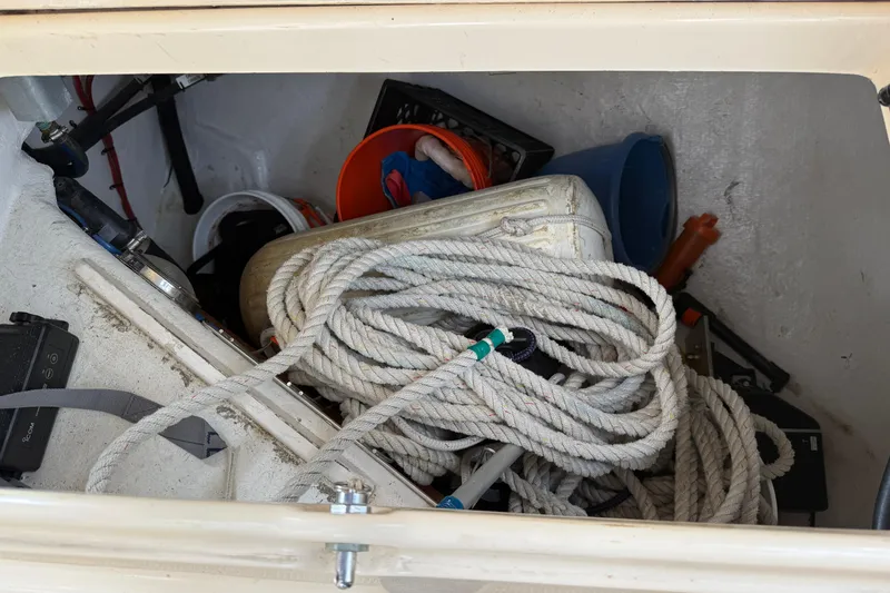Slide: The Image of Storage compartment of 2008 Island Packet 370 sailboat with ropes and equipment. - 25