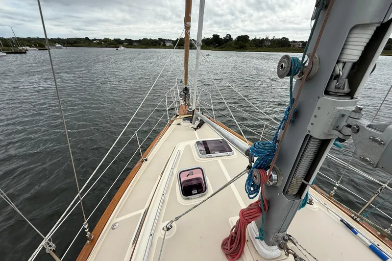 Slide: The Image of 2008 Island Packet 370 sailboat deck with rigging and water view. - 27