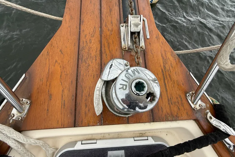 Slide: The Image of Deck of 2008 Island Packet 370 sailboat with anchor winch and wooden finish. - 29