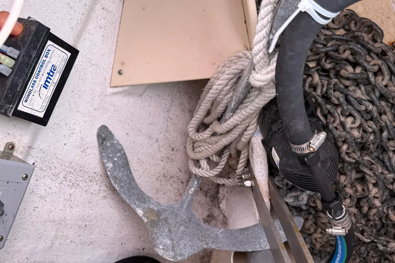 Slide: The Image of Anchor and chain storage on a 2008 Island Packet 370 sailboat. - 32
