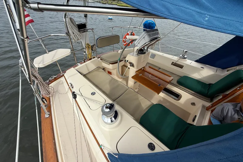 Slide: The Image of Cockpit view of 2008 Island Packet 370 sailboat with seating and navigation equipment. - 36