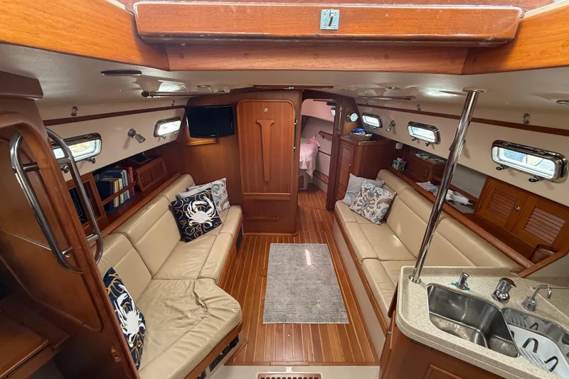 Slide: The Image of Interior of 2008 Island Packet 370 yacht with elegant wood finish and cozy seating. - 37