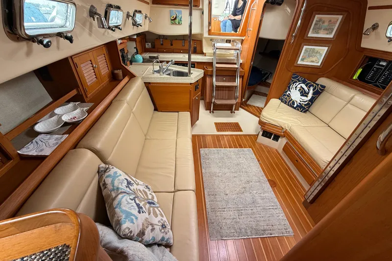 Slide: The Image of Luxurious interior of 2008 Island Packet 370 yacht with cozy seating and elegant wood finishes. - 38