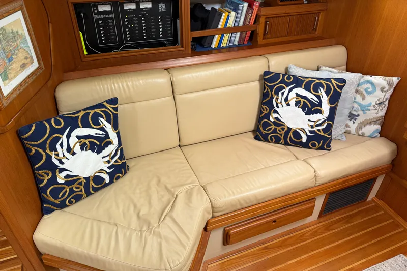 Slide: The Image of Interior of 2008 Island Packet 370 with beige sofa and decorative crab pillows. - 39