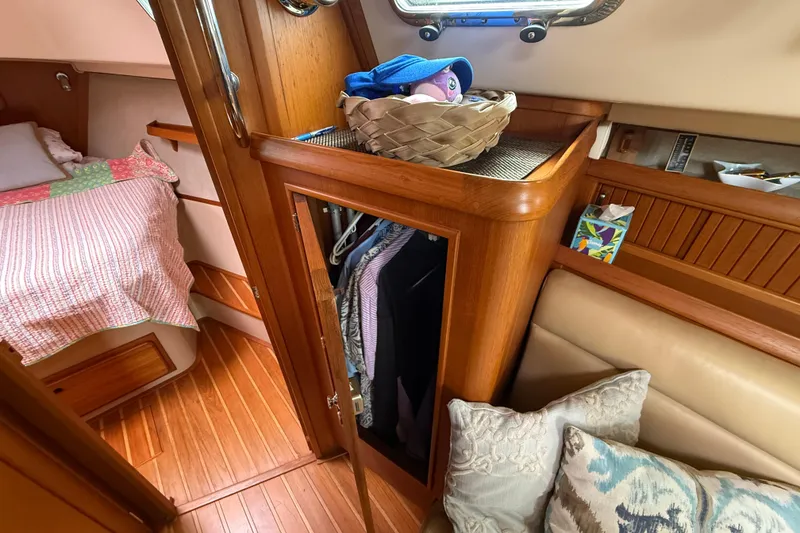 Slide: The Image of Interior of 2008 Island Packet 370 sailboat with cozy cabin and wooden finishes. - 46
