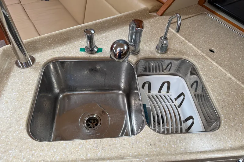 Slide: The Image of Galley sink area on 2008 Island Packet 370 yacht with dual basins and faucet. - 51