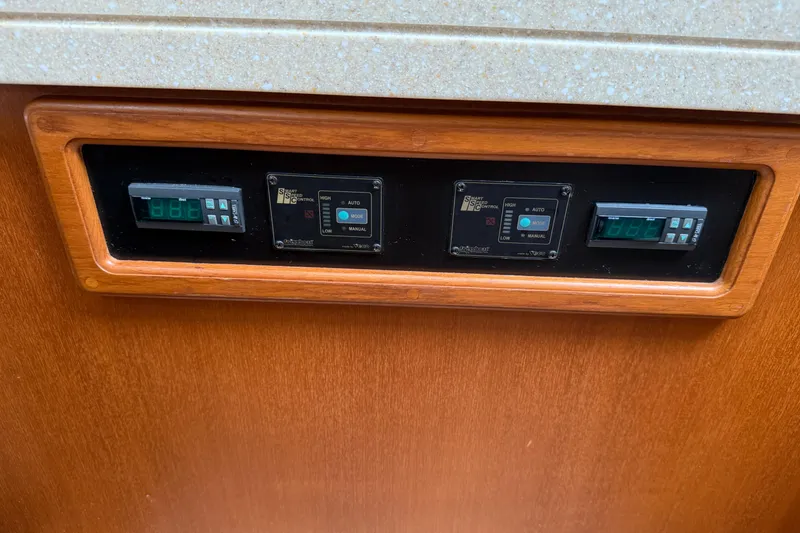 Slide: The Image of Control panel on 2008 Island Packet 370 yacht with digital displays and settings. - 58
