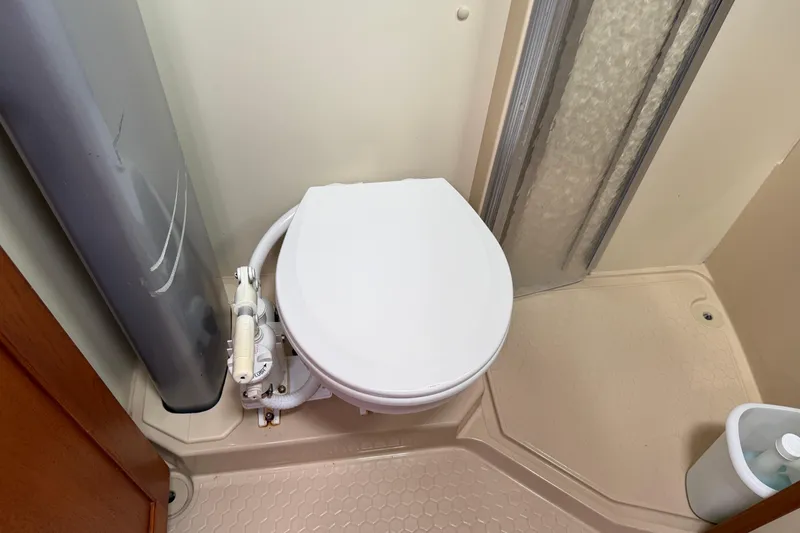 Slide: The Image of 2008 Island Packet 370 yacht bathroom with toilet and shower area. - 69