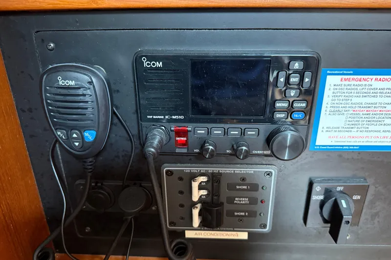 Slide: The Image of ICOM VHF marine radio setup on 2008 Island Packet 370 sailboat. - 77
