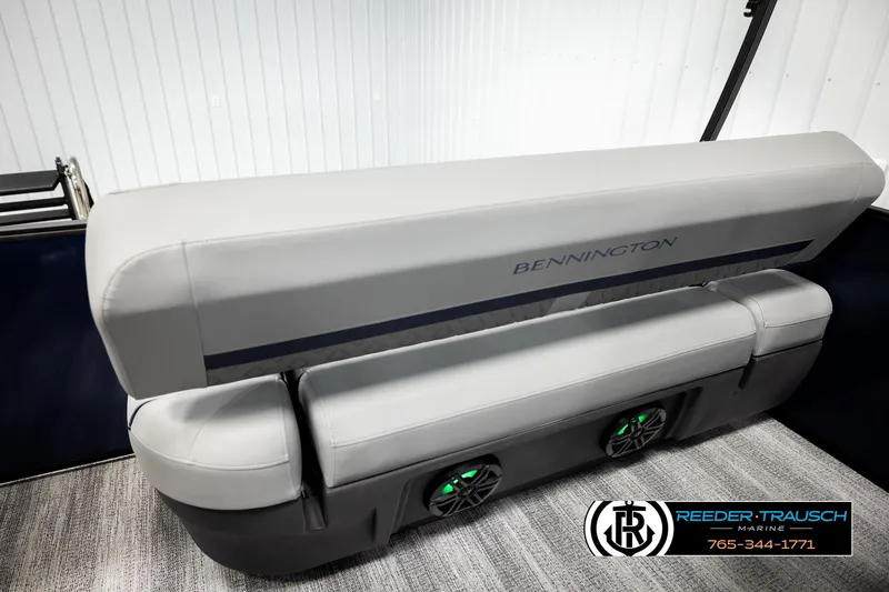 Slide: The Image of 2026 Bennington 22 MSBSE boat interior with gray seating and integrated speakers. - 22