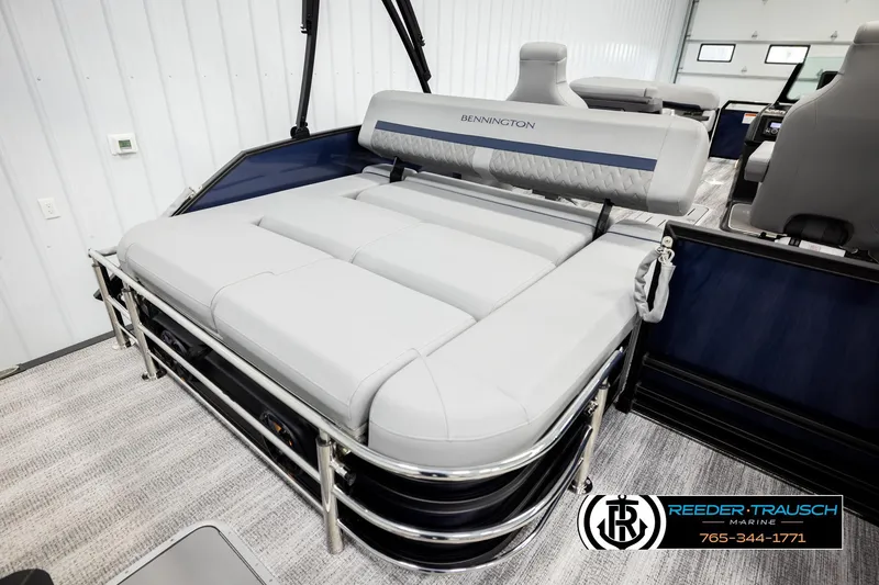 Slide: The Image of 2026 Bennington 22 MSBSE pontoon boat with luxurious seating in showroom. - 24