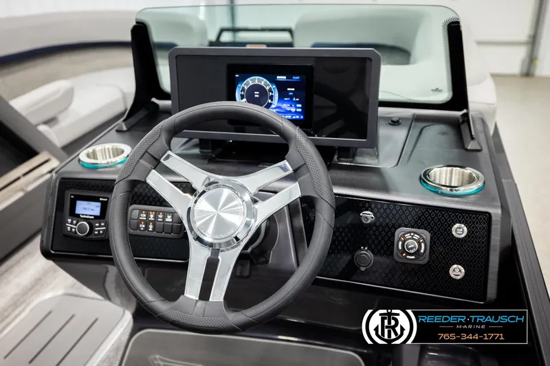 Slide: The Image of 2026 Bennington 22 MSBSE boat dashboard with steering wheel and digital display. - 33