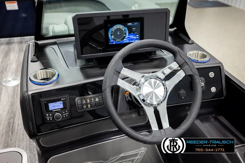 Slide: The Image of 2026 Bennington 22 MSBSE boat dashboard with steering wheel and digital display. - 34