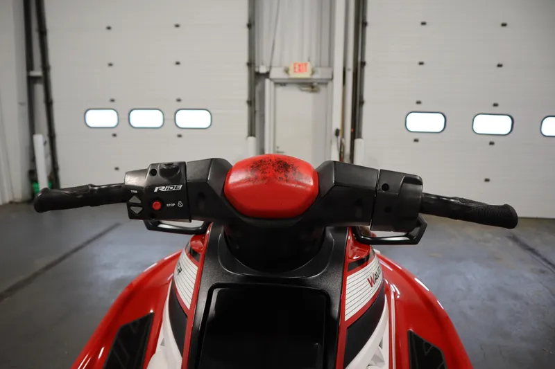 Slide: The Image of 2018 Yamaha GP1800 jet ski handlebars in a garage setting. - 13